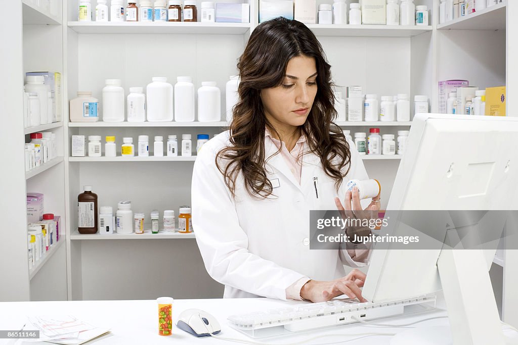 Pharmacist Using A Computer Pharmacist Using Computer High-Res Stock Photo - Getty Images
