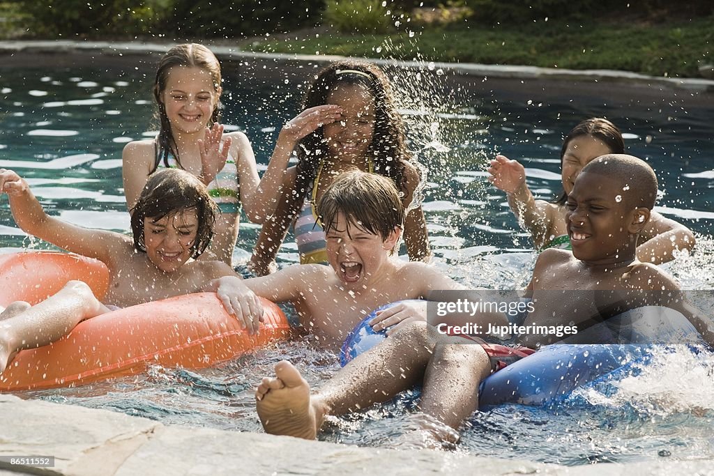 Splashing Pool Children Playing And Splashing In Swimming Pool High-Res Stock Photo ...