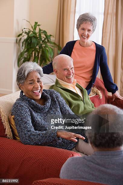friends laughing together - four day old stock pictures, royalty-free photos & images