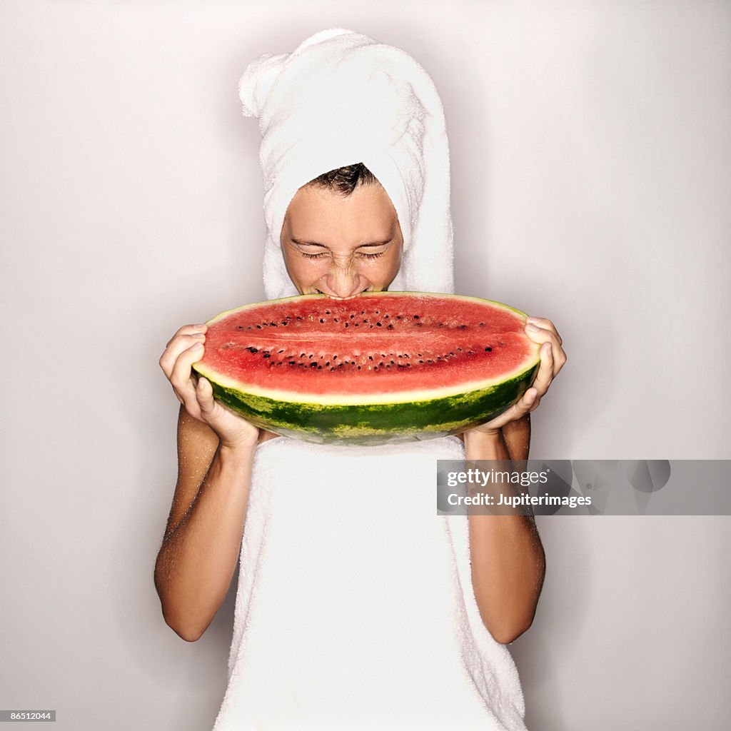 Woman eating watermelon