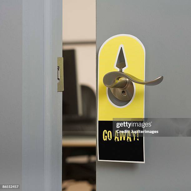 sign hanging on door - go away kort fras bildbanksfoton och bilder