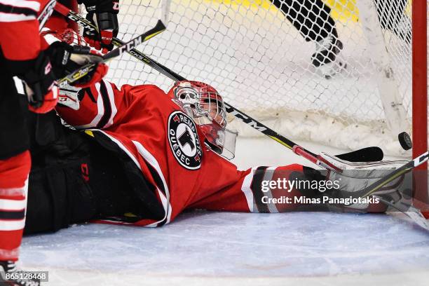 Goaltender Dereck Baribeau of the Quebec Remparts allows a goal early in the first period against the Blainville-Boisbriand Armada during the QMJHL...