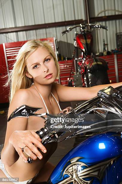 woman on motorcycle - women in skimpy bathing suits stock pictures, royalty-free photos & images
