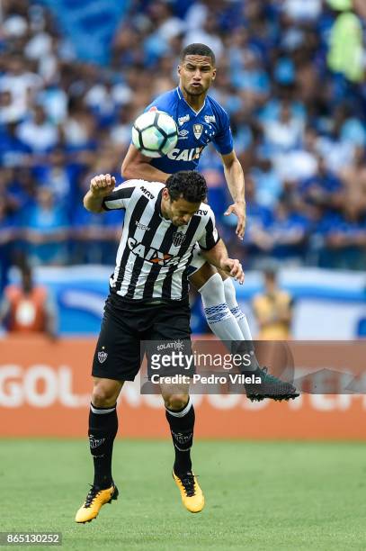 Murilo Cerqueira of Cruzeiro and Fred of Atletico MG battle for the ball during a match between Cruzeiro and Atletico MG as part of Brasileirao...
