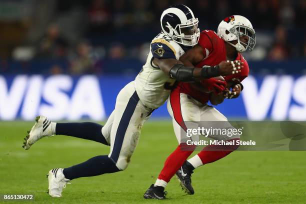 Kerwynn Williams of Arizona Cardinals is tackled by Alec Ogletree of Los Angeles Rams during the NFL game between Arizona Cardinals and Los Angeles...