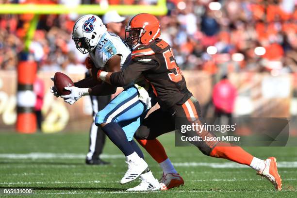 Joe Schobert of the Cleveland Browns tackles DeMarco Murray of the Tennessee Titans in the fourth quarter at FirstEnergy Stadium on October 22, 2017...