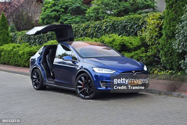 tesla model x on the street - corporate car fleet stock pictures, royalty-free photos & images