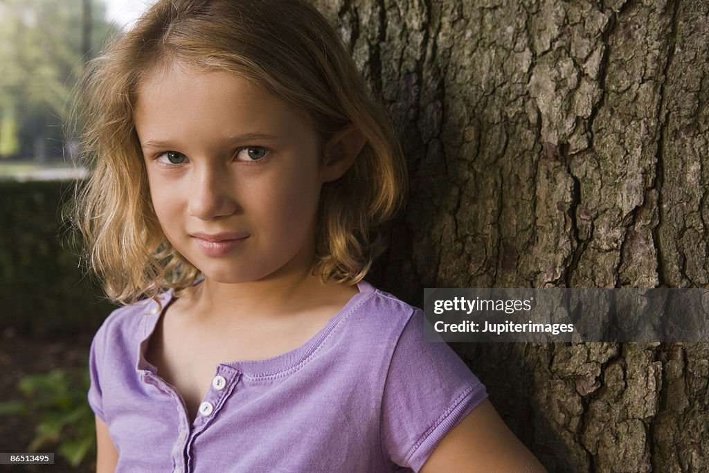 Portrait Of Girl By Tree High-Res Stock Photo - Getty Images