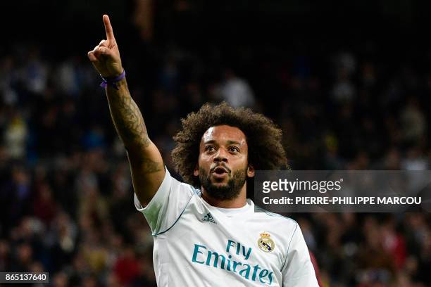 Real Madrid's Brazilian defender Marcelo celebrates after scoring his team's third goal during the Spanish league football match Real Madrid CF vs SD...