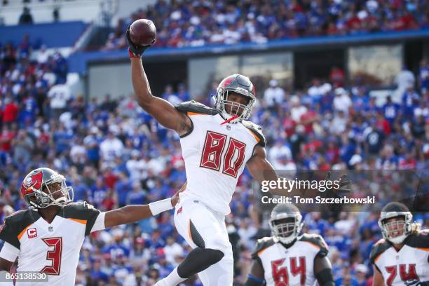 Howard of the Tampa Bay Buccaneers celebrates with teammates after scoring a touchdown during the third quarter of an NFL game against the Buffalo...