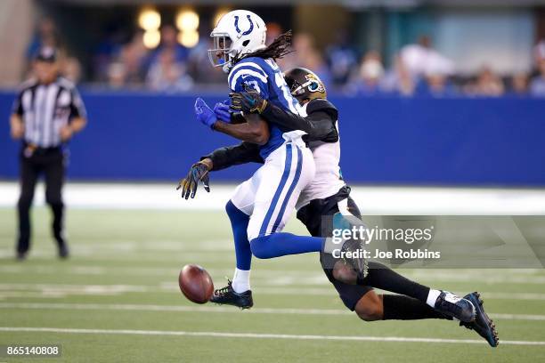 Hilton of the Indianapolis Colts drops a pass defended by Jalen Ramsey of the Jacksonville Jaguars during the third quarter at Lucas Oil Stadium on...