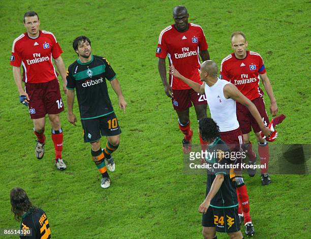 Alex Silva of Hamburg shouts at Diego of Bremen during the UEFA Cup Semi Final second leg match between Hamburger SV and SV Werder Bremen at the HSH...