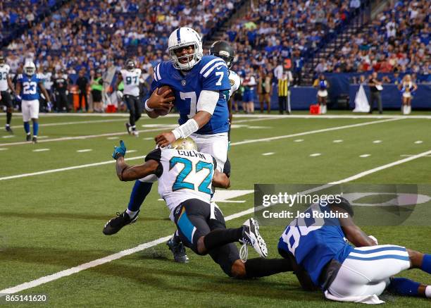 Jacoby Brissett of the Indianapolis Colts is tackled by Aaron Colvin of the Jacksonville Jaguars during the fourth quarter at Lucas Oil Stadium on...