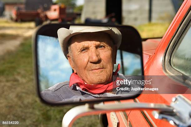 reflection of man in rearview mirror - side view mirror stock pictures, royalty-free photos & images