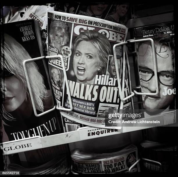 Eight months after the 2016 presidential election, tabloids still advertise headlines about Hilary Clinton at supermarket check out line on August 1,...