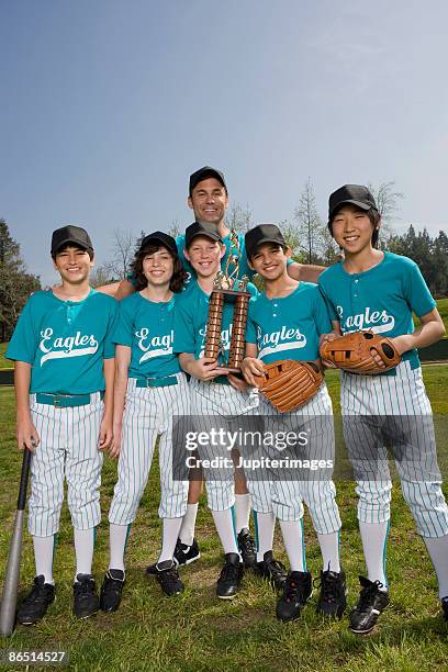 portrait of little league players and coach with trophy - american influences awards stock pictures, royalty-free photos & images