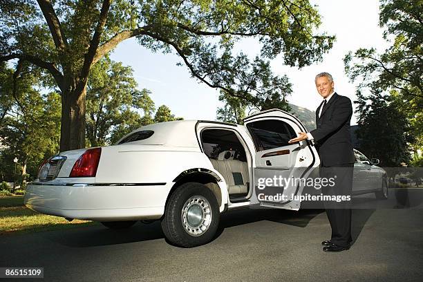 limousine chauffeur opening door - limousine bildbanksfoton och bilder