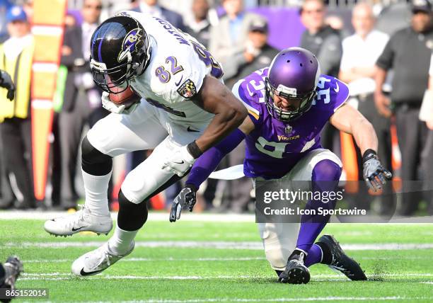 Minnesota Vikings safety Andrew Sendejo hits Baltimore Ravens tight end Benjamin Watson during a NFL game between the Minnesota Vikings and Baltimore...