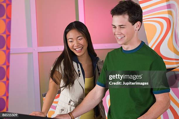 teenagers playing pinball - pinball stock pictures, royalty-free photos & images