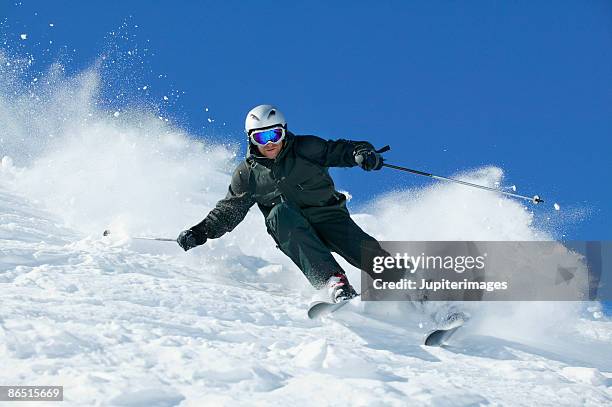 man snow skiing - downhill skiing fotografías e imágenes de stock