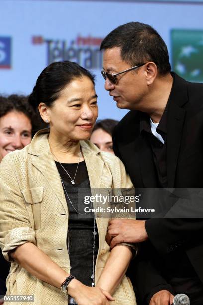 Wong Kar-wai and his wife Ye-cheng Chan aka Esther Wong attend the closing ceremony of 9th Film Festival Lumiere on October 22, 2017 in Lyon, France.