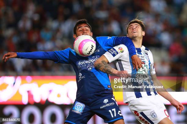 Alonso Zamora of Puebla struggles for the ball with Angelo Sagal of Pachuca during the 14th round match between Pachuca and Puebla as part of the...