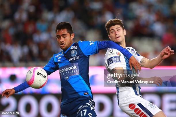 Alonso Zamora of Puebla struggles for the ball with Angelo Sagal of Pachuca during the 14th round match between Pachuca and Puebla as part of the...