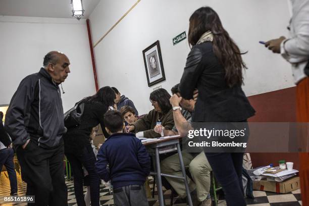 Voters register to cast ballots at a polling station in Buenos Aires, Argentina, on Sunday, Oct. 22, 2017. Argentines will have the opportunity to...