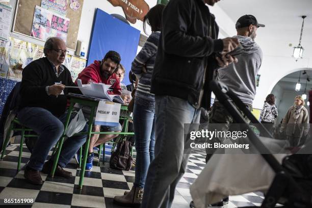 Voters register to cast ballots at a polling station in Buenos Aires, Argentina, on Sunday, Oct. 22, 2017. Argentines will have the opportunity to...