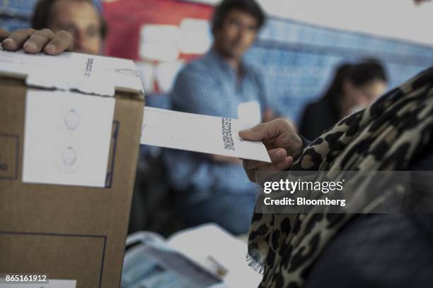 Voter casts a ballot at a polling station in Buenos Aires, Argentina, on Sunday, Oct. 22, 2017. Argentines will have the opportunity to send a...