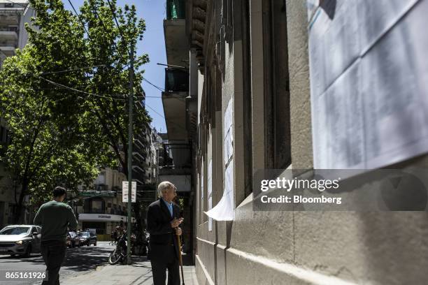 Voter checks a registration list outside of a polling station in Buenos Aires, Argentina, on Sunday, Oct. 22, 2017. Argentines will have the...