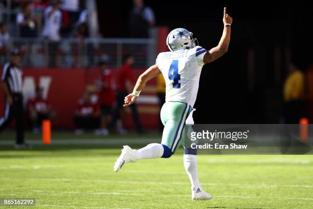 Dak Prescott of the Dallas Cowboys celebrates after a 72-yard touchdown run by Ezekiel Elliott against the San Francisco 49ers during their NFL game...