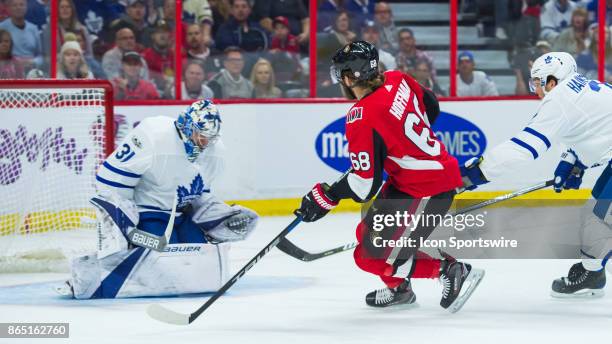 Toronto Maple Leafs Goalie Frederik Andersen makes a chest save against Ottawa Senators Left Wing Mike Hoffman as Toronto Maple Leafs Defenceman Ron...