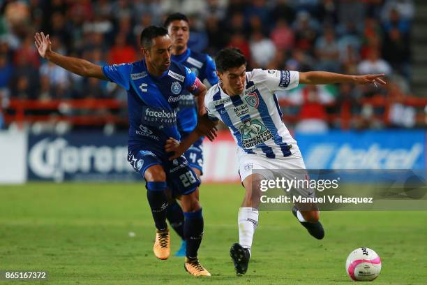 Erick Gutierrez of Pachuca fights for the ball with Francisco Torres of Puebla during the 14th round match between Pachuca and Puebla as part of the...