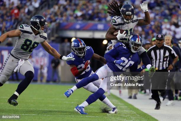 DeAndre Elliott of the Seattle Seahawks is knocked out-of-bounds by Janoris Jenkins of the New York Giants during the second quarter of the game at...