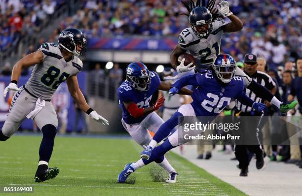 DeAndre Elliott of the Seattle Seahawks is knocked out-of-bounds by Janoris Jenkins of the New York Giants during the second quarter of the game at...