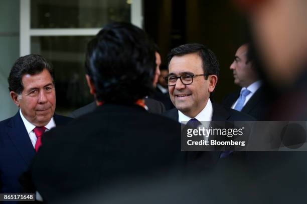 Ildefonso Guajardo Villarreal, Mexico's secretary of economy, right, speaks with attendees during the Mexico Business Summit in San Luis Potosi,...