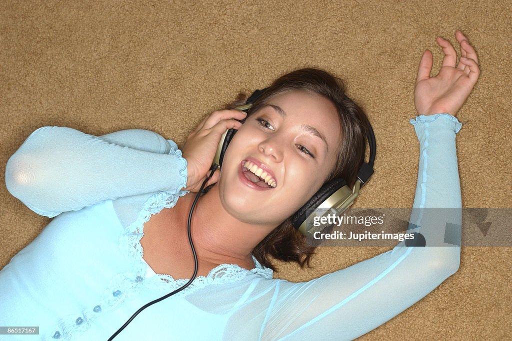 Teenage girl wearing headphones