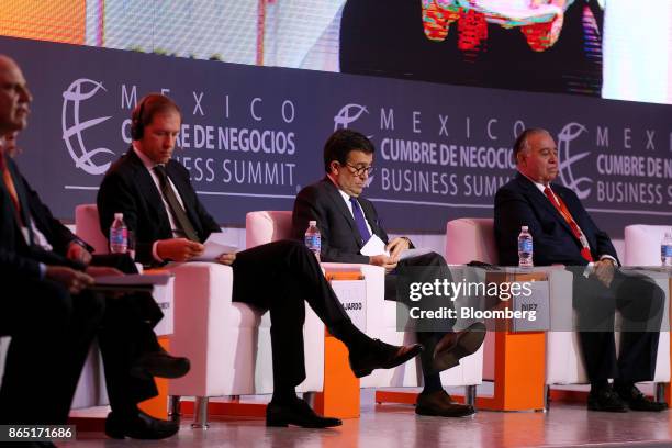 Ildefonso Guajardo Villarreal, Mexico's secretary of economy, center, and Denis Manturov, Russia's trade and industry minister, second left,...