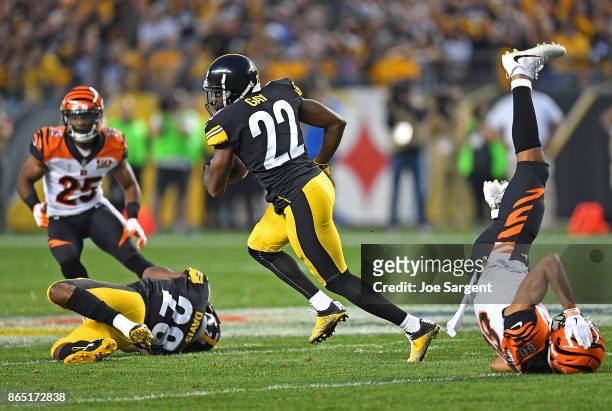 William Gay of the Pittsburgh Steelers runs after intercepting a pass thrown by Andy Dalton of the Cincinnati Bengals in the second half during the...