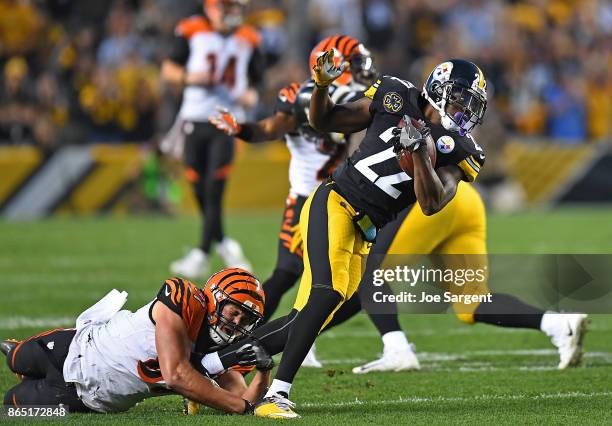 William Gay of the Pittsburgh Steelers is tackled after intercepting a pass thrown by Andy Dalton of the Cincinnati Bengals in the second half during...