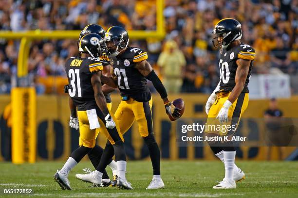 Joe Haden of the Pittsburgh Steelers celebrates with Mike Hilton after intercepting a pass thrown by Andy Dalton of the Cincinnati Bengals in the...