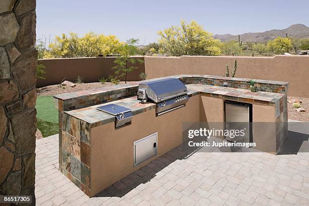 outdoor counter and grill - outdoor kitchen stock pictures, royalty-free photos & images