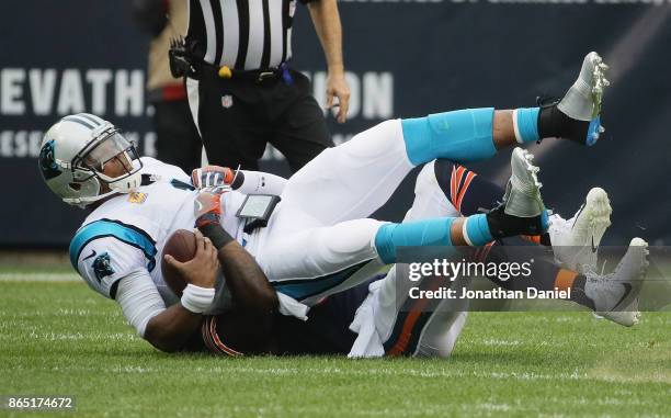 Cam Newton of the Carolina Panthers is sacked by Danny Trevathan of the Chicago Bears at Soldier Field on October 22, 2017 in Chicago, Illinois. The...