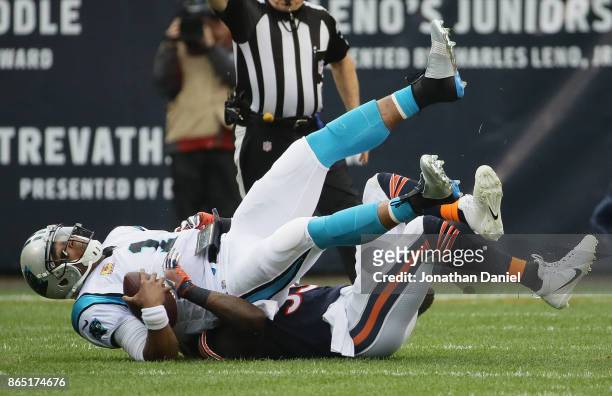 Cam Newton of the Carolina Panthers is sacked by Danny Trevathan of the Chicago Bears at Soldier Field on October 22, 2017 in Chicago, Illinois. The...