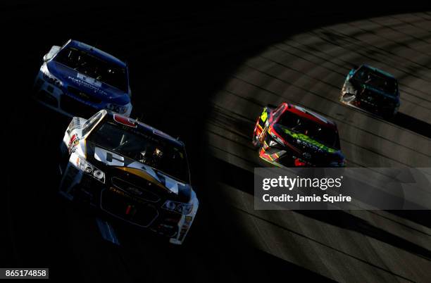 Ryan Newman, driver of the Caterpillar Chevrolet, leads a pack of cars during the Monster Energy NASCAR Cup Series Hollywood Casino 400 at Kansas...