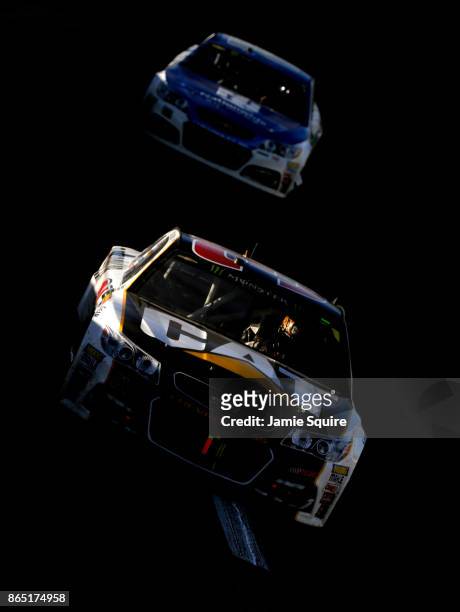 Ryan Newman, driver of the Caterpillar Chevrolet, leads Dale Earnhardt Jr., driver of the Nationwide Chevrolet, during the Monster Energy NASCAR Cup...