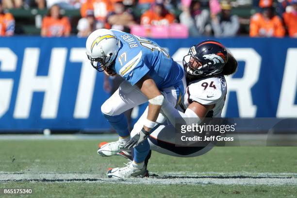 Domata Peko of the Denver Broncos sacks quarterback Philip Rivers of the Los Angeles Chargers during the third quarter of the game at the StubHub...