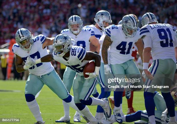 Dallas Cowboys safety Xavier Woods comes up with the fumble recovery on a punt return during the first quarter as the Cowboys beat the San Francisco...