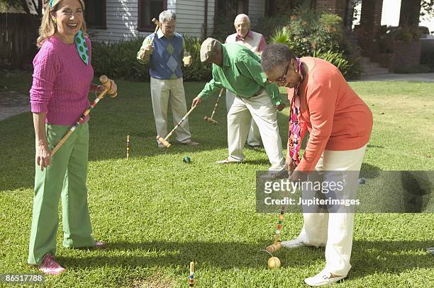 people playing croquet - bent golf club stock pictures, royalty-free photos & images